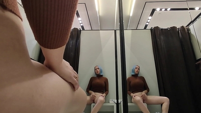 Masturbation in a fitting room without a door. Horny blonde gets a strong orgasm in a public place