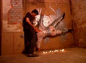 Kinky Stud Gets a Unique Blowjob From a Slut Taped on a Wall