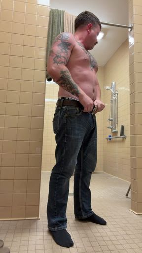 Uncut tattoo jock showering after gym