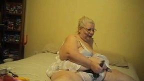 My favorite BBW granny in her bed again masturbating with a strapon