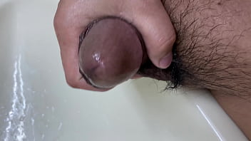 Cleaning up a brown cute cock after pissing