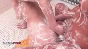 Brunette JAV stunner gobbles cock in shower close up