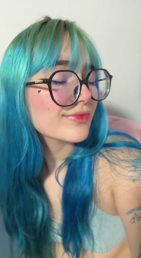 Blue haired woman in glasses