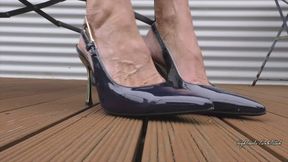 Toe and Heel Tapping with elegant blue pointy High Heel Slingbacks Outdoors