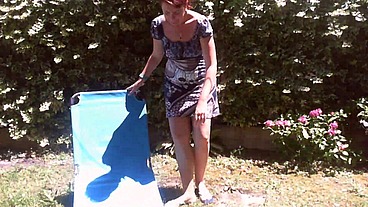 Italian girl sunbathing in a public garden with a big dirty diaper