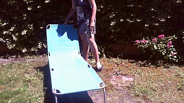Italian girl sunbathing in a public garden with a big dirty diaper