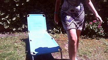 Italian girl sunbathing in a public garden with a big dirty diaper