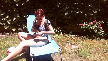 Italian girl sunbathing in a public garden with a big dirty diaper