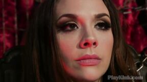 Fetish domina torturing slave in red stockings