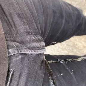 Pissing my black jeans outside