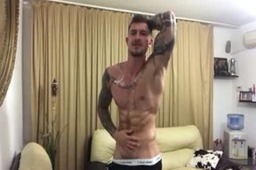 Tattooed dude Oils Up And Jerks Off
