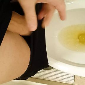 Piss at the airport toilet and shaking cock after peeing