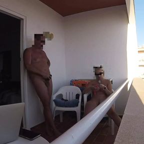 Mutual masturbating on balcony