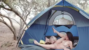 Two passionate lesbians with natural tits make love all over the camping site