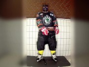 Rubber hockey pup pawing off