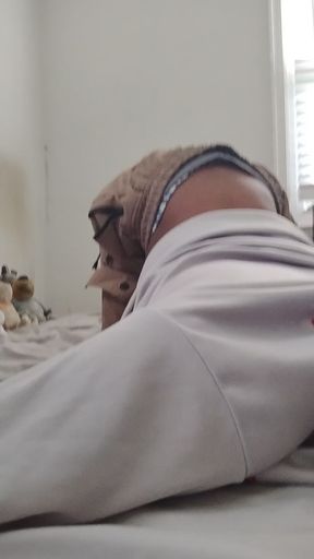 Lying on bed, a slim solo girl shows