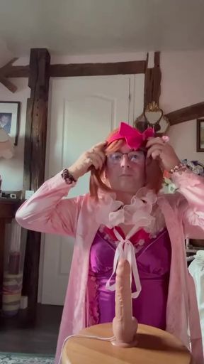 In outfit with a fuchsia nightie with a cum stain to suck a dildo