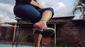 Cute high heels dangling from a mature woman's feet (1)