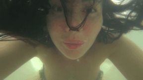 Blowing bubbles underwater in the bathtub Bb