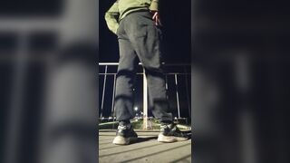 Plunging his cock out and showcasing his butt on the road.