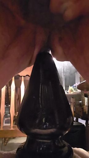 Close-up View of Asspussy Training to Gape With 14 Inch Circumference Assmaster Plug
