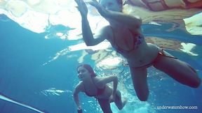 Underwater strip tease by naughty babe Marusia and her pretty girlfriend