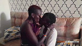 Real-life ebony lesbians enjoy a horny session of tribbing and fingering.