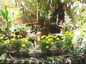 Half naked planting flowers