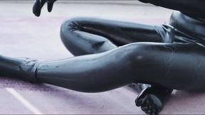Latex girl takes punishment by holding a dildo in her mouth