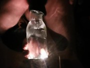 PV TAking Lit Glass Bottle With Head In Back Porch