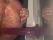 Fucking dildo against open window