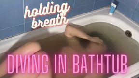 Diving in bathtub and hold breath