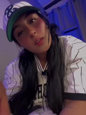 Woman in white and black baseball cap