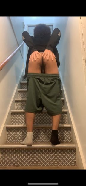 Lowering my shorts and showing my ass off at staircase