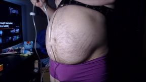 Belly inflation in purple boyshorts