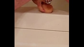 Man in Chastity fucks dildo hard
