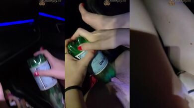 My whore fucks herself with a bottle in the car squirting climax