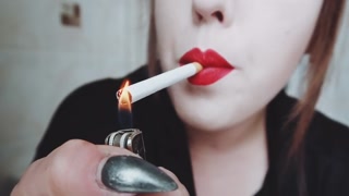 MISTRESS WITH LUSCIOUS RED LIPS CLOSE-UP SMOKING CIGARETTE