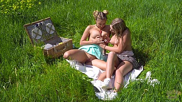 Lesbian picnic with lollipop play