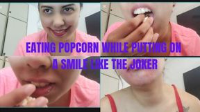 EATING POPCORN WHILE PUTTING ON A SMILE LIKE THE JOKER