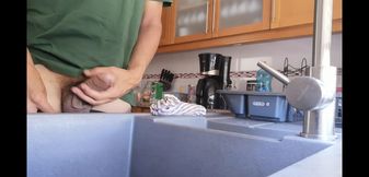 Hot guy jerks off into the kitchen sink