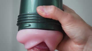Extreme close up of cock in slow motion with Fleshlight and finished by cumshot