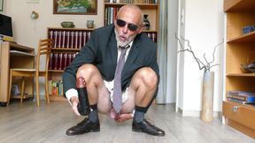 Man in Suit Plays with His Dildo