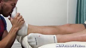 ”Half naked hunk lies down while a dude licks his toes too”