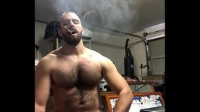 Sexy Hairy Muscle Stud Jerking off in garage while smoking a cigar And Blowing a Huge Load FunMrSmith Bearded Stud