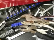 Mechanic plays with his tools