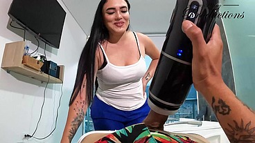 The cleaning girl helps him with his new toy by sucking him
