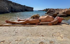 Shemale Mistress Plays Outdoor with Her Slave Paul on the Rocks on Ibiza