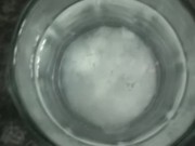 Dude cumming in a glass of water