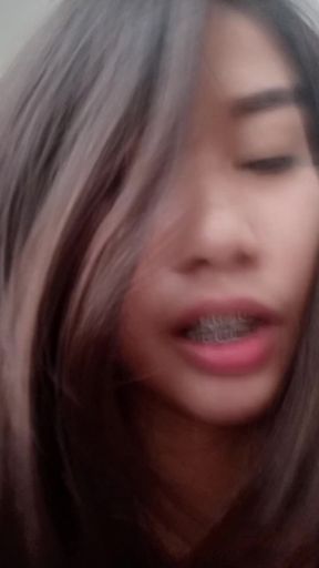Hot wife moans while taking a load, braces make her smile cute